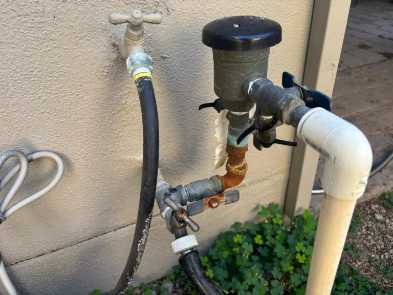 Corroded irrigation backflow preventer before replacement