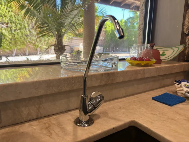 Dedicated reverse osmosis drinking water faucet installed at a kitchen sink